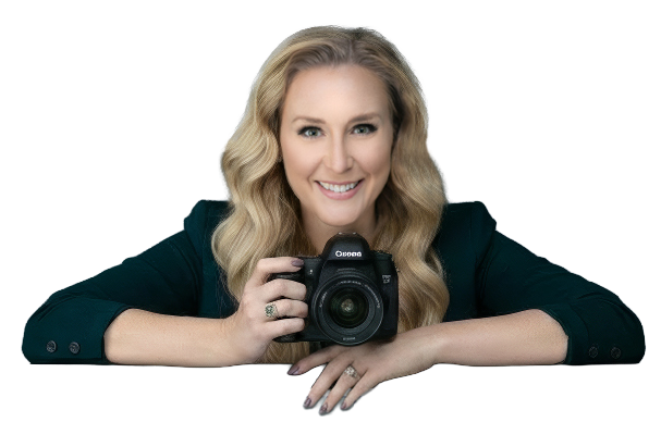 Kristi Sherk — AI headshot photographer with 20 years of experience, holding a professional camera